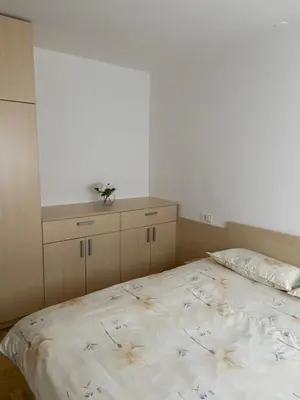 a bedroom with a bed with flowers on it at Bee's Place Holiday Home Kranjska Gora in Kranjska Gora
