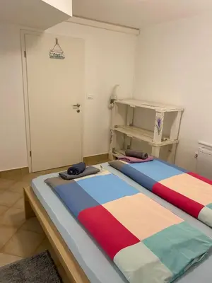 two beds sitting in a room with at Room Julija in Žirovnica