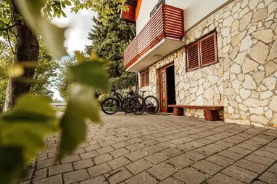 a group of bikes parked next to a building at Cozy family place 'Hiša Grozdek' - Gruškovec 40A in Gruškovec