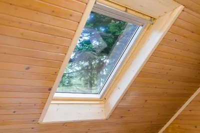 a room with a window in a wooden house at Chalet Liza & Rozi in Zgornja Ložnica