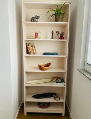 a book shelf in a room with books at Gogalova Apartments in Ljubljana