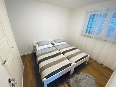 a bed in a room with a window at Gogalova Apartments in Ljubljana