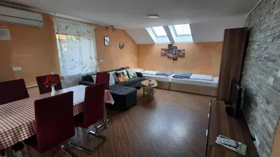 a living room with a couch and a table at Hiša Bizjak in Kranj