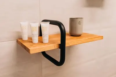 a wooden shelf with four cups on a wall at Štekner house Apartma in Ljubno