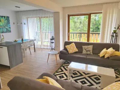 a living room with a couch and a table at NUMBER 10 Apartments in Bled