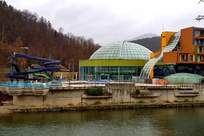 a large building with a slide and a water park at Villa СARPE DIEM in Laško