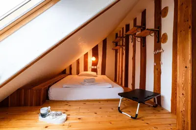 a bedroom with a bed in the attic at Turistična kmetija Grabnar in Bled