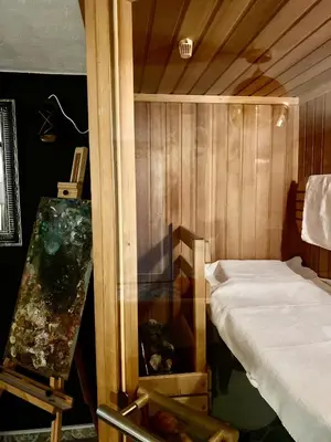 a room with a bed and a painting on a table at Rooms & Apartment ZALA Near Airport & Cable Car in Cerklje na Gorenjskem