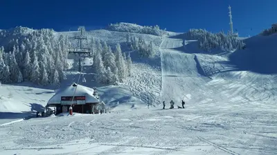 a group of people skiing on a ski slope at Hiša v mesečini - Moonlight house in Cerklje na Gorenjskem