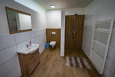 a bathroom with a toilet and a sink and a shower at Glamping Logar in Luče