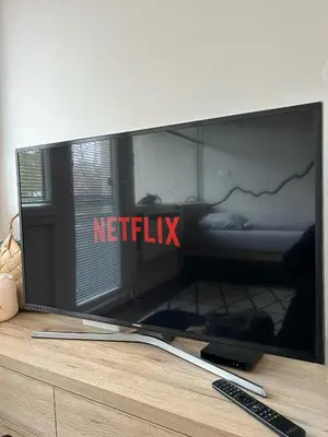 a television sitting on top of a dresser at Apartma Prisojnik Kranjska Gora in Kranjska Gora