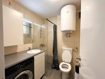 a bathroom with a toilet and a sink at Apartma Prisojnik Kranjska Gora in Kranjska Gora