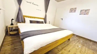 a bedroom with a bed and a desk in it at The Apartment - Ljubljana in Ljubljana