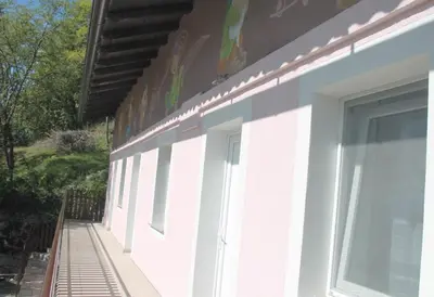 a row of windows on the side of a building at Mike's Rooms in Kobarid
