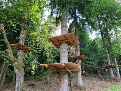 two trees with wooden structures on them at Apartments Apple Garden 4P in Bled