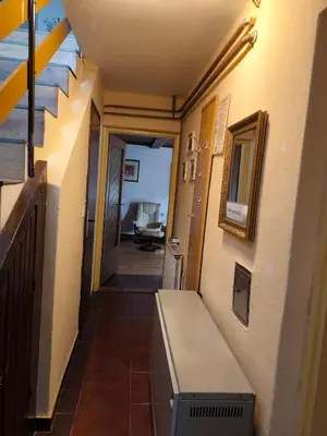 a hallway with a bench in a room at Hiša Jezersko in Zgornje Jezersko
