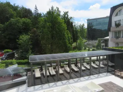 a group of chairs on the balcony of a building at Peony in Rogaška Slatina