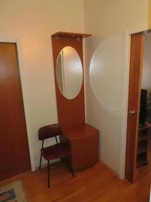 a dressing room with a mirror and a chair at Peony in Rogaška Slatina