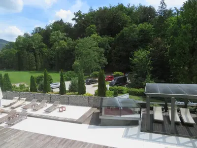 a row of chairs on a roof with a parking lot at Peony in Rogaška Slatina