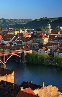 a city with a bridge over a river with buildings at NEW GUEST HOUSE 13 in Maribor