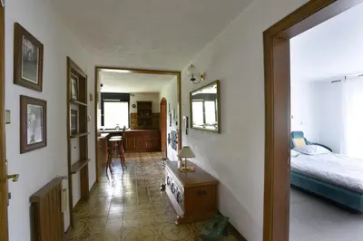 a bedroom with a bed and a table in a room at LakeView Apartment in Preddvor
