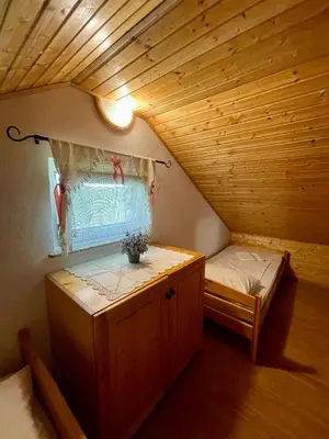 a small room with a bed and a window at Cosy country home, Lendava in Lendava