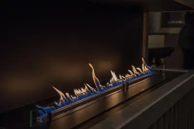 a row of blue and white flames on a counter at Vila De Casa in Ribnica