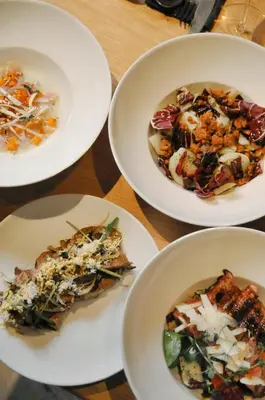 a group of plates of food on a table at Vila De Casa in Ribnica