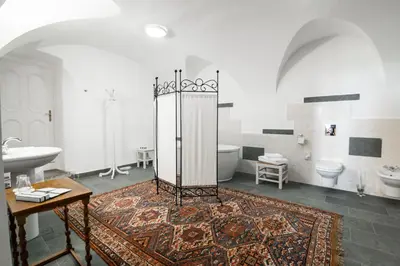 a bathroom with a tub and a toilet and a sink at Grad Strmol in Cerklje na Gorenjskem