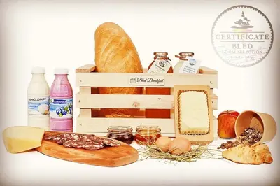 a table with bread and other food items at Effie Perine Apartments in Bled