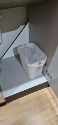 a white toilet sitting inside of a cabinet at APARTMAN MURKO P-3 in Brest