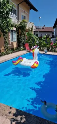 a pool with a inflatable duck in the water at APARTMAN MURKO P-3 in Brest