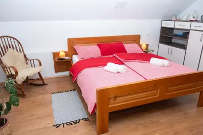 a bedroom with a bed with two towels on it at Apartma ''Pri Movernu'' in Semič