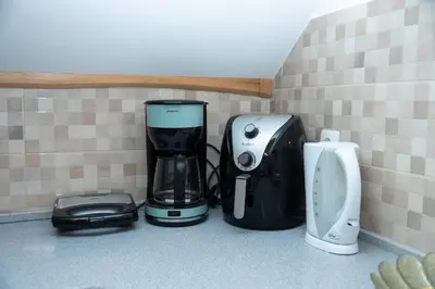 a coffee maker and a blender sitting on a counter at Apartma ''Pri Movernu'' in Semič