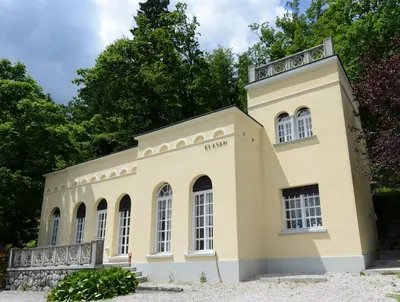 an old building with a tower on top of it at Villa Elasan in Bled