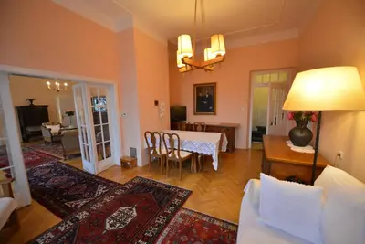 a living room with a table and a dining room at Villa Elasan in Bled