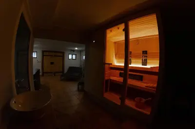 a room with a window with a bed in it at Andy's Holiday Home with HotTub & Sauna in Podbočje