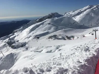 a snow covered mountain with a ski lift at Apartma Manfreda Bovec in Bovec