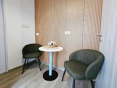two chairs and a table in a room at Central Ljubljana Apartment , 150m from Prešeren Square in Ljubljana
