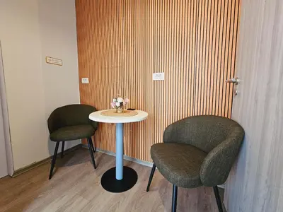 two chairs and a table in a room at Central Ljubljana Apartment , 150m from Prešeren Square in Ljubljana