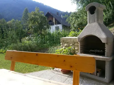 a pizza oven sitting on top of a bench at Apartment Žvan in Bohinj