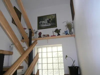 a room with a staircase with a window at Apartment Žvan in Bohinj