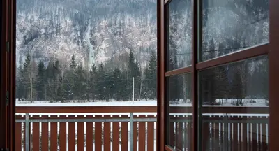 a view of a mountain from a window at Apartment Brina in Kranjska Gora