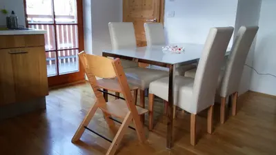 a dining room with a table and chairs at Apartment Brina in Kranjska Gora