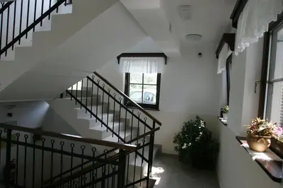 a hallway with stairs and a window in a building at Farm Stay Frank Ozmec Wine and Glamping estate in Ljutomer