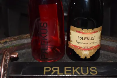 a bottle of sauce next to a bottle of wine at Farm Stay Frank Ozmec Wine and Glamping estate in Ljutomer