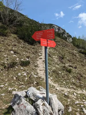 a red sign sitting on top of a mountain at M & M apartment Krvavec in Cerklje na Gorenjskem