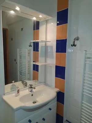 a bathroom with a sink and a mirror at M & M apartment Krvavec in Cerklje na Gorenjskem