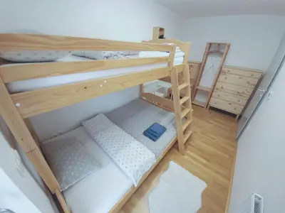 an overhead view of two bunk beds in a room at Apartma M&J in Mojstrana