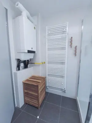a small bathroom with a shower and a sink at Apartma M&J in Mojstrana